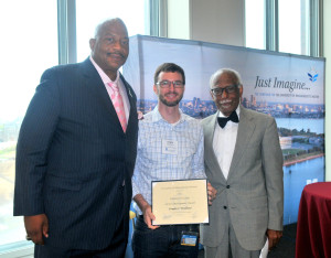  Dr. Woodhams receives the Endowed Faculty Career Development Award,presented by UMass Boston Chancellor J. Keith Motley (pictured left) and UMass Boston Provost Winston E. Langley (pictured right).